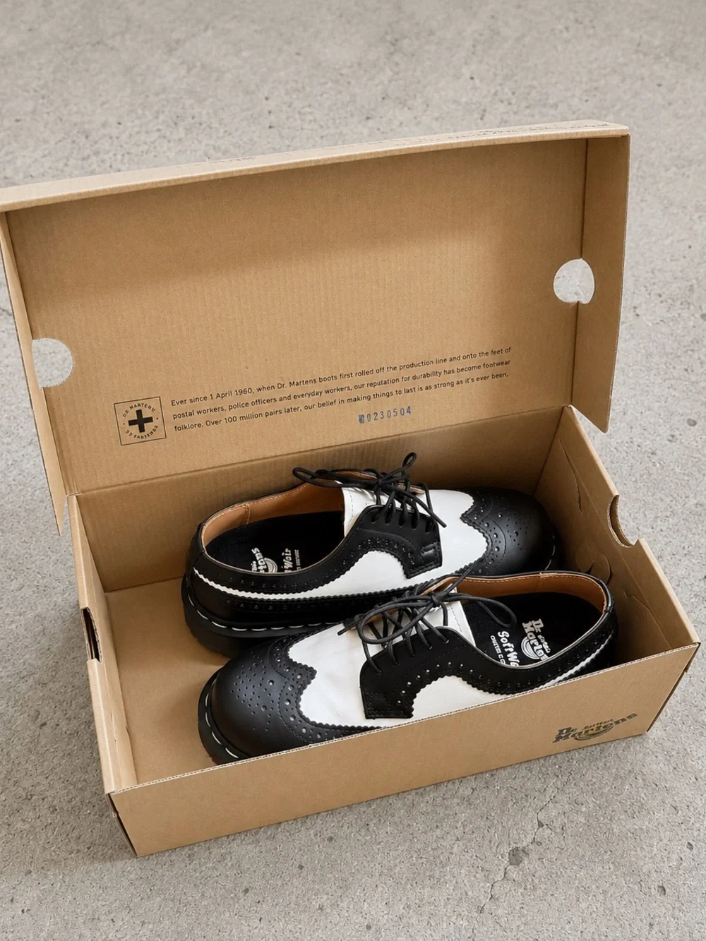 Dr. Martens Black & White Brogue Saddle Oxfords